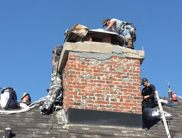 Santa Monica Chimney Sweep installing a custom chimney crown in Santa Monica, CA