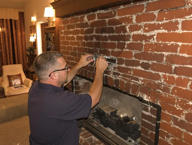 Santa Monica Chimney Sweep expert fixing a fireplace in Santa Monica, CA